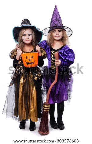 Witch children with trick or treat. Halloween. Fairy. Tale. Studio portrait isolated over white background