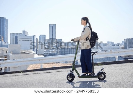 Similar – Image, Stock Photo Woman on electric kick scooter