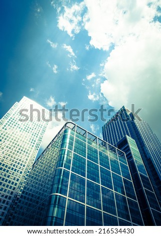 LONDON, UK - JUNE 7, 2006: A low angle view looking up at the high rise skyscrapers within London\'s Docklands district.  Canary Wharf stands to the left while the Citigroup tower is to the right.