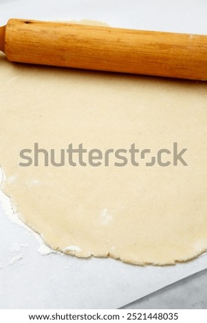 Image, Stock Photo Dough rolled out on a green background. Homemade pie crust and rolling pin. Baking concept