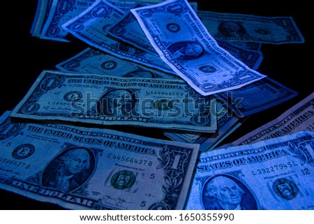1. 5 dollars - United States paper currency under UV light. Verifying the authenticity.Suspicious, fake falsificate 1 Imagine de stoc © 