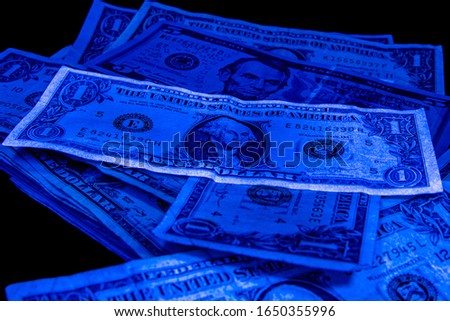 1. 5 dollars - United States paper currency under UV light. Verifying the authenticity.Suspicious, fake falsificate 1 Imagine de stoc © 