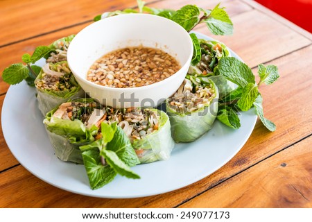 Nem Cuon - Vietnam food,Vietnamese fresh summer rolls filled with prawns, pork, herbs, rice vermicelli and vegetables. Served with hoisin and peanut sauce dip and nuoc mam cham