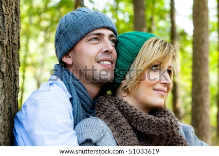 Healthy embracing nature sitting couple