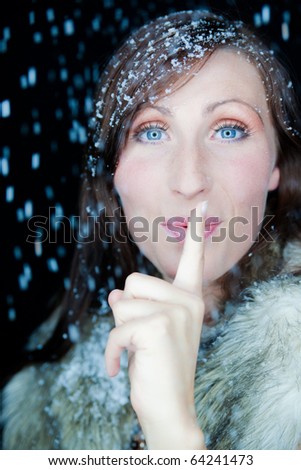 Happy funny female portrait looking snowflakes falling down  in december season