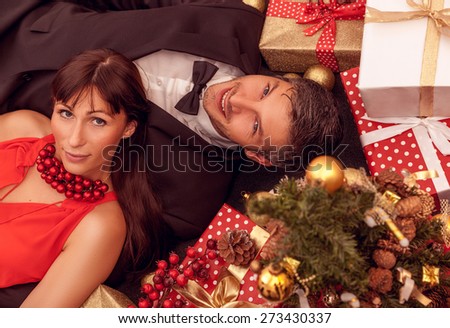 formal dressed fashion people with gift