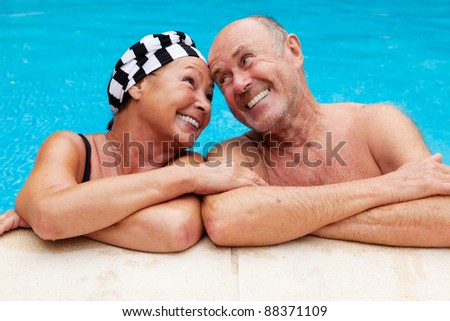 Similar – Image, Stock Photo Mature couple swimming together in fresh water