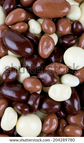 chocolate covered nuts and raisins background