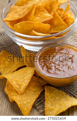 tortilla chips and tomato dip in a bowl