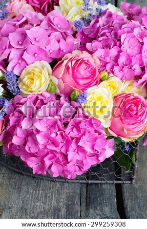 beautiful hydrangea and rose bouquet over white background