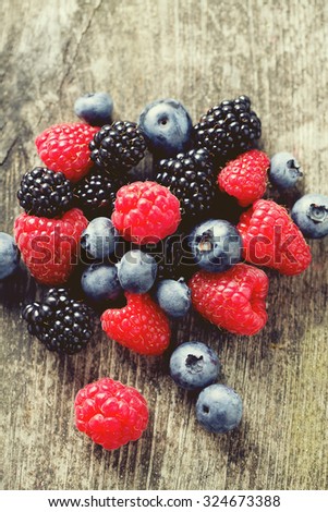 summer berries on wooden surface