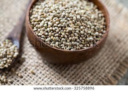 hemp seeds on wooden surface