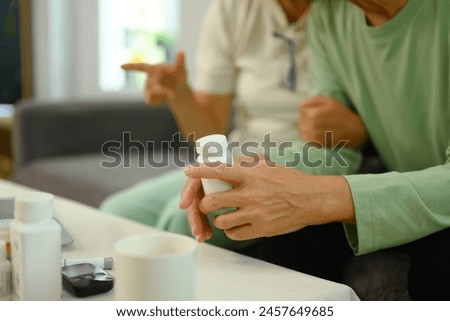 Similar – Image, Stock Photo Senior man taking prescription medicine at home