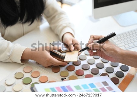 Similar – Image, Stock Photo Architects working material in the foreground, in the background a blurred employee in front of the monitor