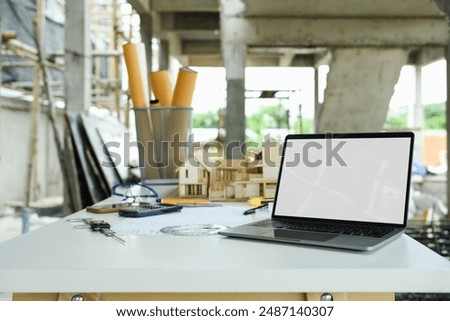 Similar – Image, Stock Photo blueprints, protective helmet, laptop,house model and tools on architect workspace.Construction site