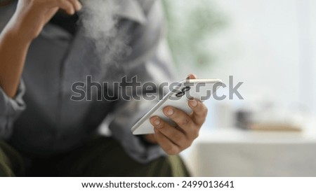 Similar – Image, Stock Photo Adult man smoking cannabis joint