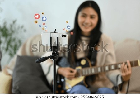 Similar – Foto Bild Zufriedene Frau spielt zu Hause Gitarre