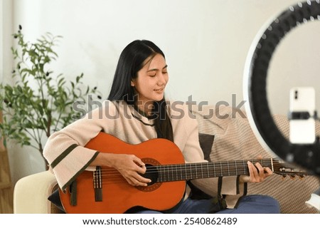 Similar – Foto Bild Zufriedene Frau spielt zu Hause Gitarre