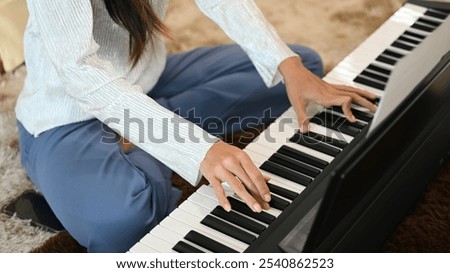 Similar – Image, Stock Photo Crop woman playing piano at home