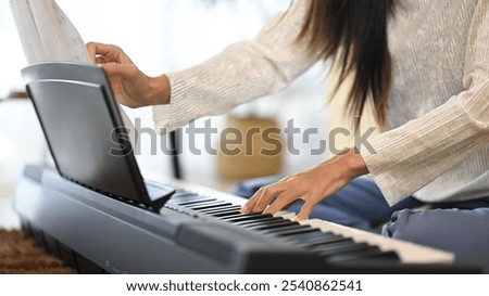 Similar – Image, Stock Photo Crop woman playing piano at home