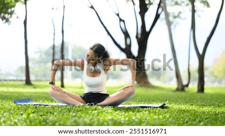 Image, Stock Photo Flexible young sportswoman practicing yoga on street