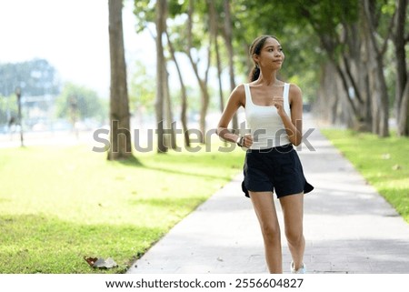 Similar – Image, Stock Photo Happy African American sportswoman with bottle of water