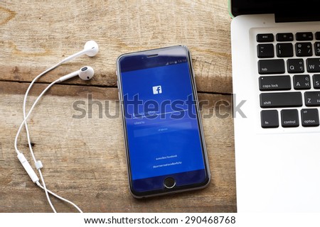CHIANGMAI, THAILAND -JUNE 25, 2015:Photo of new Apple iPhone 6 Plus smartphone device open facebook application.