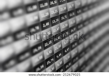 Stock market price digital display abstract. Modern virtual technology, photograph binary code on abstract technology background. Media gray and black image with graphs and icons. Shallow DOF effect