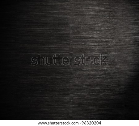 Dark wood texture, dramatic light and vignette