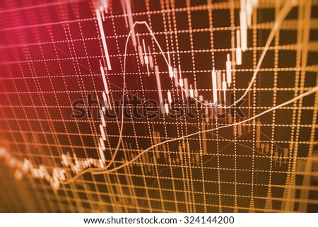 Stock market graph and bar chart price display. Data on live computer screen. Display of quotes pricing graph visualization. Abstract financial background trade on colorful computer monitor display.