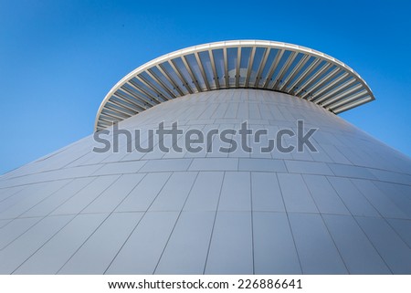 MACAU, CHINA: OCTOBER 17, 2014: Top of science museum of Macau which is the modern architecture with nice blue sky