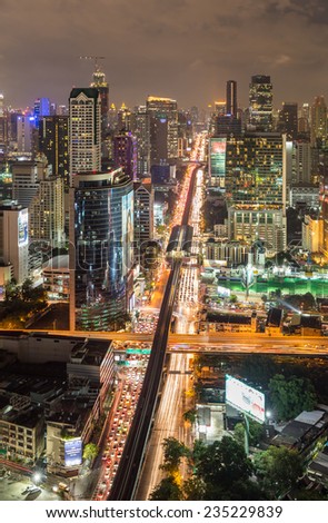 Bangkok, Thailand - December 2, 2014: Bangkok city night scenary with busy traffic and cloudy sky