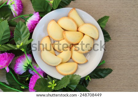 thai dessert name Keaw-ko in white plate and decoration with artificial flower