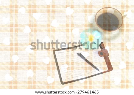 coffee and notebook on chessboard pattern fabric background