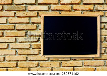 blackboard on old dirty brick wall