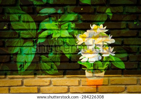 white flower vase on table with old dirty brick wall background