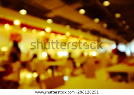 blur indoor restaurant with light in warm tone