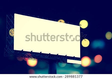 billboard on background from bokeh of traffic light and car