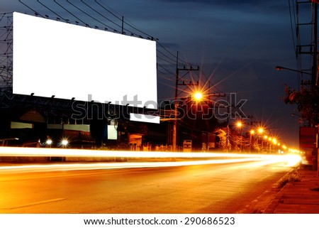 billboard at night  time with blur and flare from street light in vintage tone