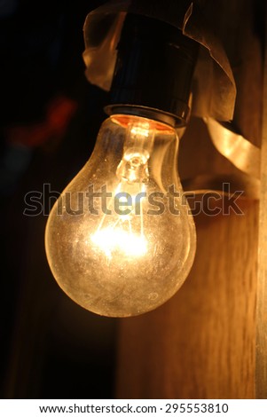 closeup image of light bulb is turn on in the dark
