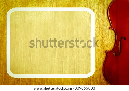 white frame and part from body of violin on wooden background ,vintage tone