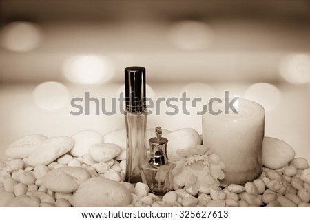 scented candles and cosmetic container on blur bokeh light in restaurant background ,vintage tone