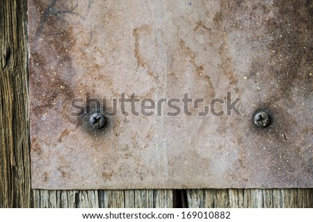 metal plate on old wood texture