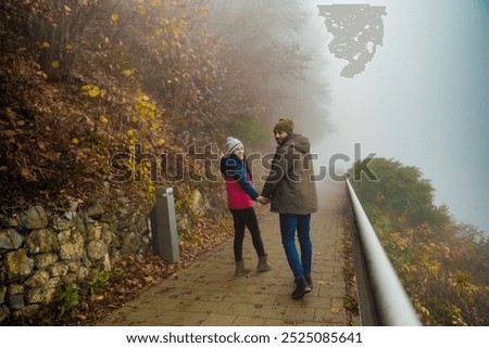 Similar – Foto Bild Menschen gehen auf nebliger Brücke