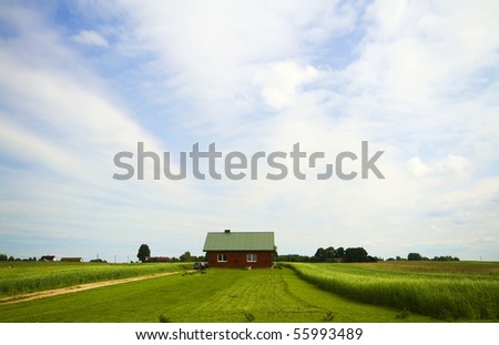 country house in the middle of fields