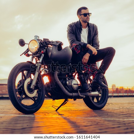 Similar – Image, Stock Photo Man sitting on motorcycle and surfing mobile