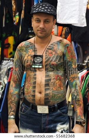 SAINT PETERSBURG - JUNE 20, 2010: A man model at St.Petersburg Tattoo Festival  - a four-day event on  art of tattooing, body modification, body art June 20, 2010 in St. Petersburg, Russia.