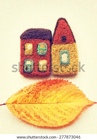 little houses and autumn leaf. real estate, place for your advertisement.