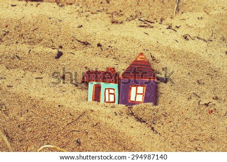 little houses on beach sand