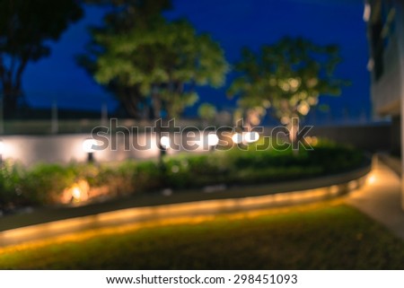Abstract night garden light bokeh in twilight, defocused background